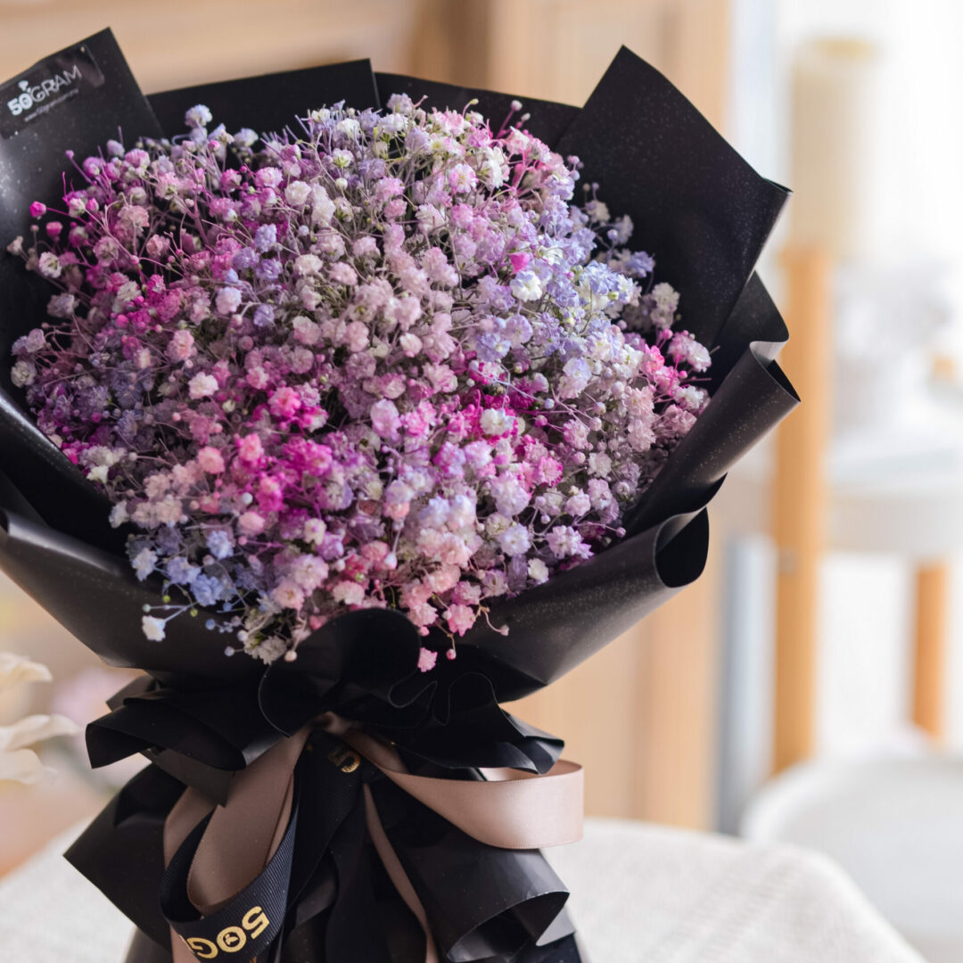 Purple colour baby breath flower bouquet with blurred background