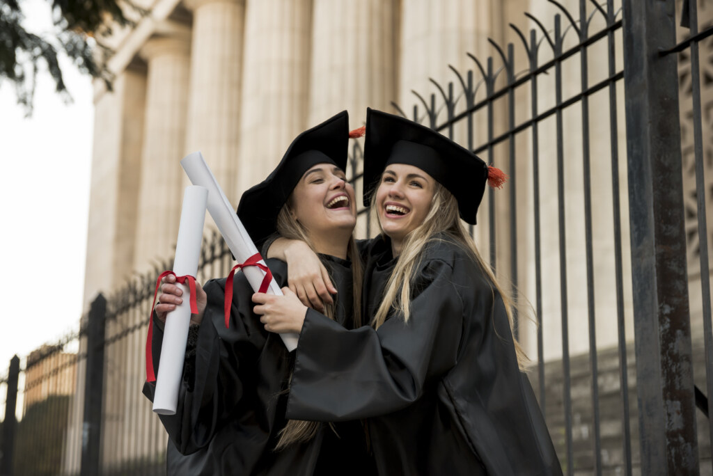 Cheerful colleagues graduating college