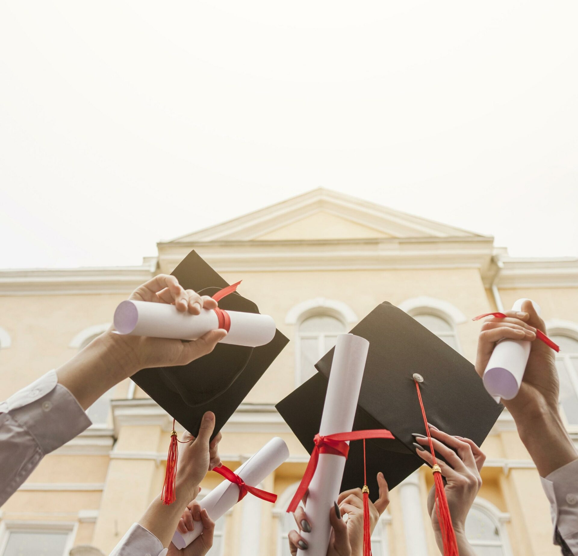 Low angle students with diploma scaled